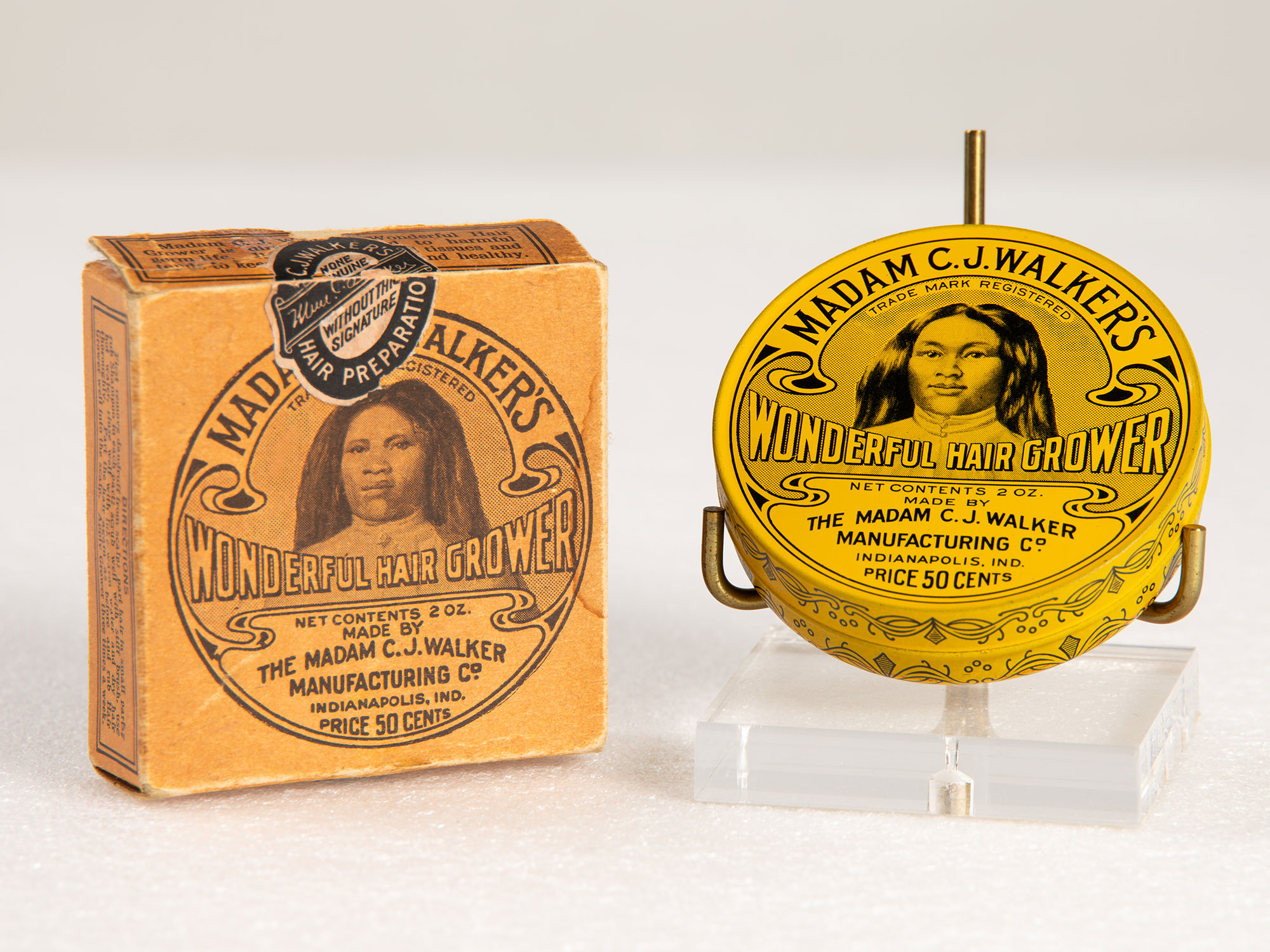 Madame C.J. Walker Wonder Hair Grower and Scalp Ointment tins.